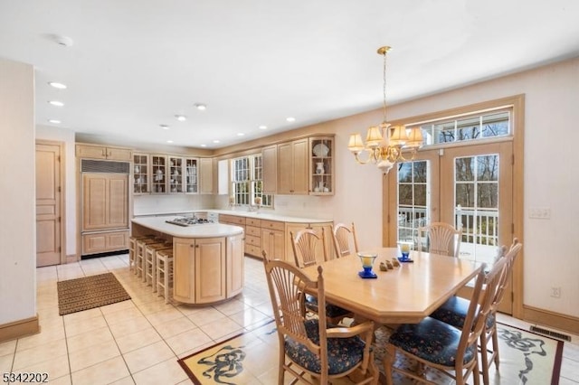 dining area with a notable chandelier, light tile patterned flooring, visible vents, and recessed lighting