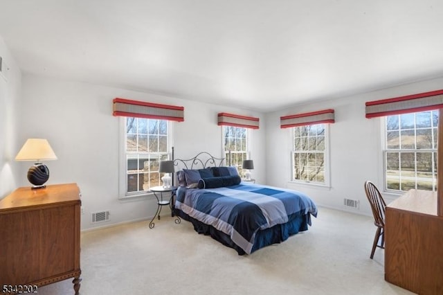 carpeted bedroom with visible vents