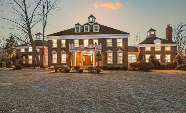 colonial home with a balcony