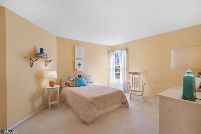 bedroom featuring carpet flooring and baseboards