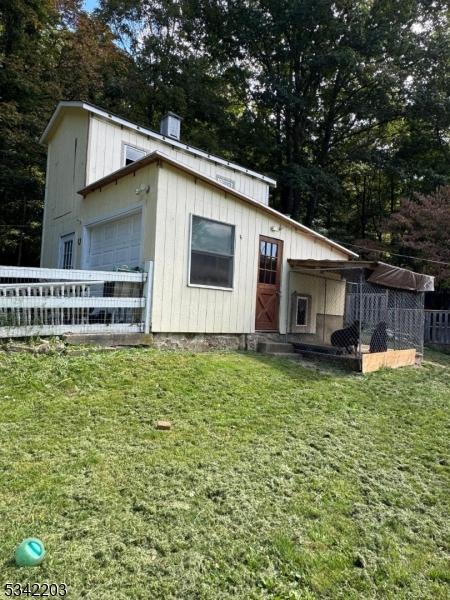 view of outdoor structure with fence