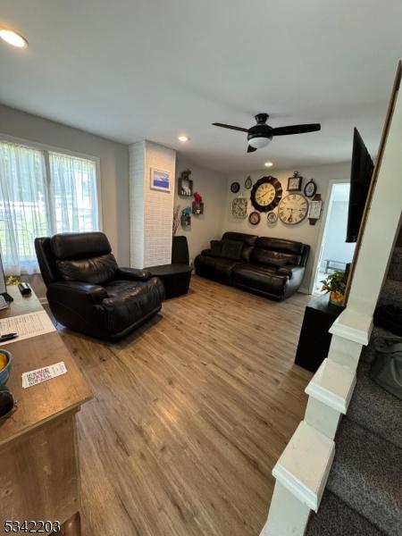 living room featuring recessed lighting, ceiling fan, and wood finished floors