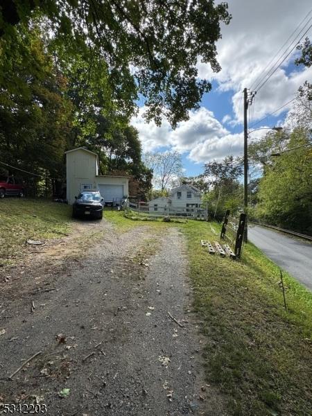 view of road with driveway