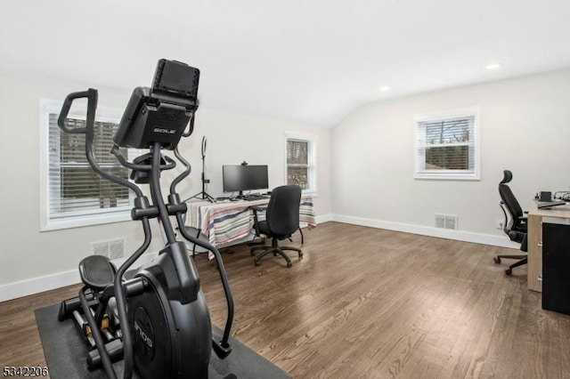 office area featuring visible vents, baseboards, and wood finished floors