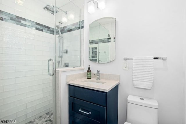 full bath with toilet, a shower stall, and vanity