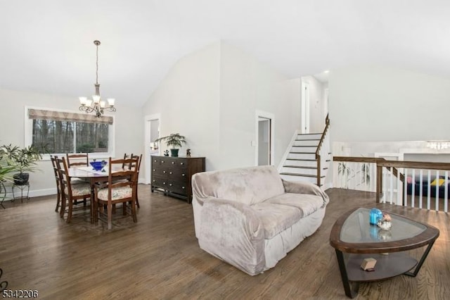 living area with baseboards, wood finished floors, stairs, vaulted ceiling, and a chandelier