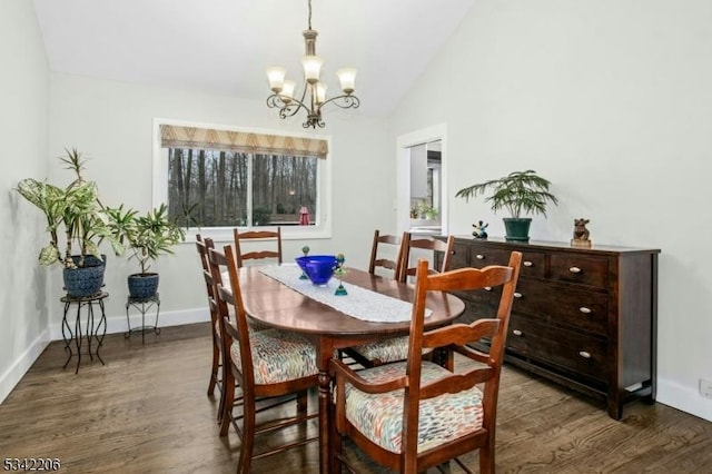 dining space featuring a notable chandelier, baseboards, vaulted ceiling, and wood finished floors