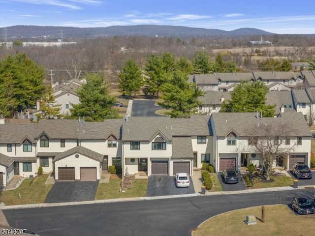 aerial view featuring a mountain view and a residential view