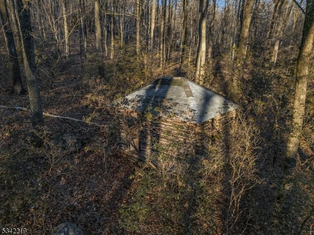 exterior space with a view of trees