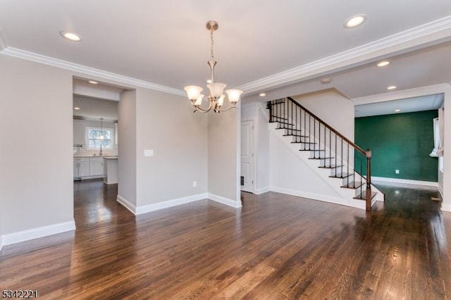 empty room with crown molding, stairs, baseboards, and wood finished floors