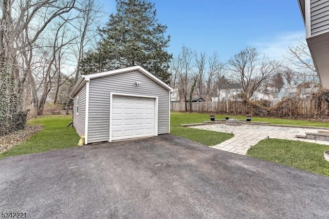 detached garage featuring driveway