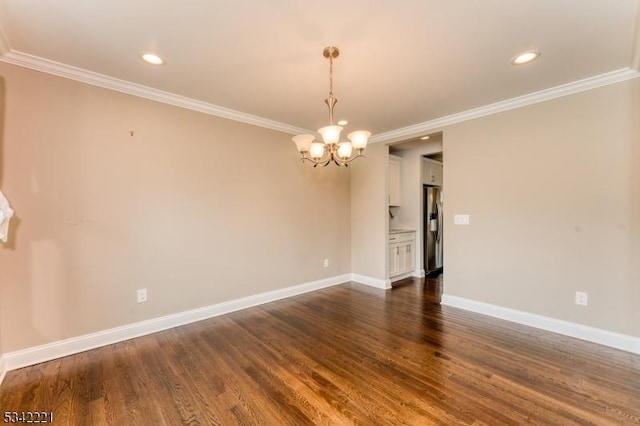 unfurnished room with crown molding, dark wood finished floors, and baseboards