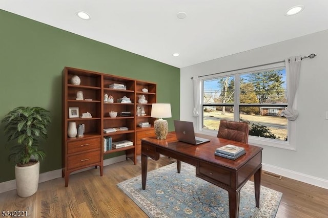 office area with recessed lighting, visible vents, baseboards, and wood finished floors