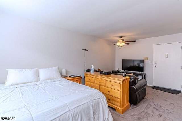 bedroom featuring ceiling fan and light colored carpet