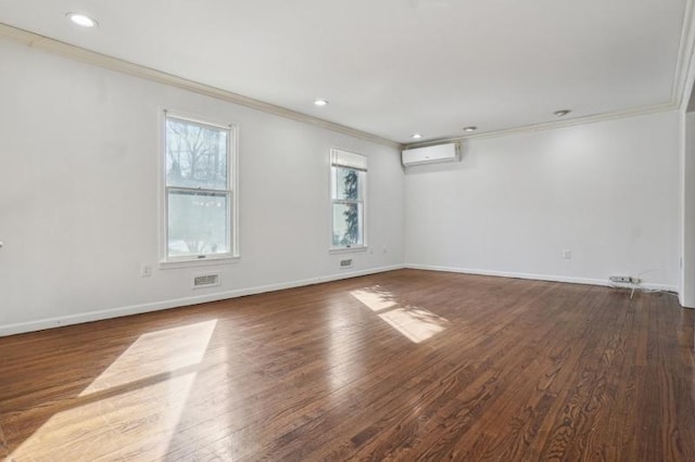 empty room with a wall mounted air conditioner, dark wood finished floors, and crown molding