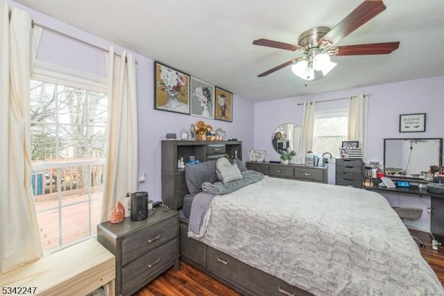 bedroom with ceiling fan and dark wood-style flooring