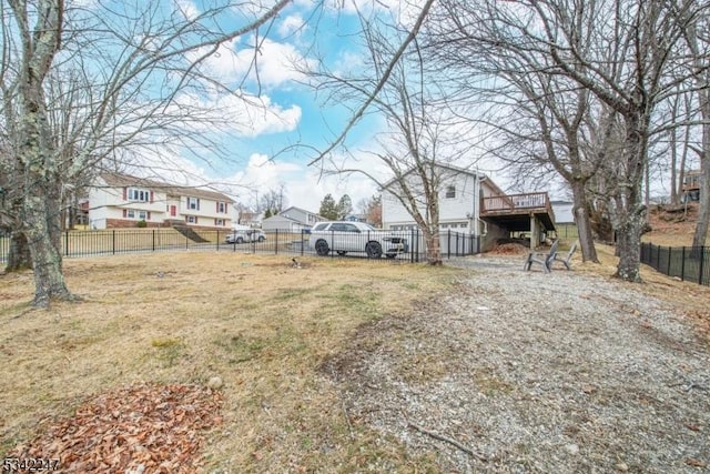 view of yard featuring a fenced backyard and a wooden deck