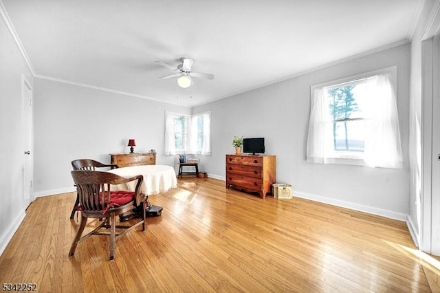 bedroom with ornamental molding, baseboards, light wood finished floors, and a ceiling fan