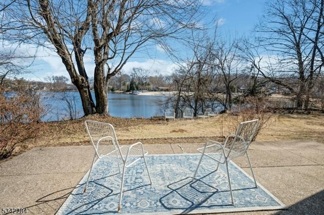 view of patio featuring a water view