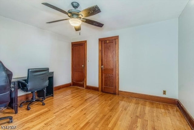 office with ceiling fan, light wood-style flooring, and baseboards