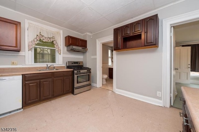 kitchen with white dishwasher, a sink, baseboards, light countertops, and stainless steel gas stove