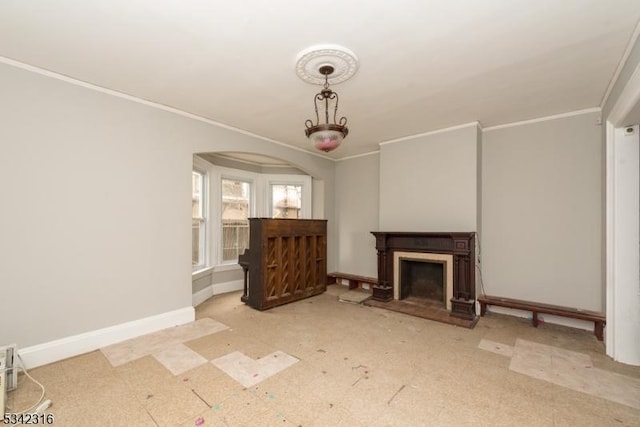 unfurnished living room featuring ornamental molding, a fireplace with raised hearth, baseboards, and tile patterned floors