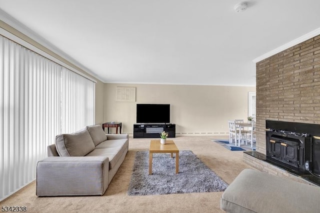 living room with carpet floors, a baseboard heating unit, and crown molding