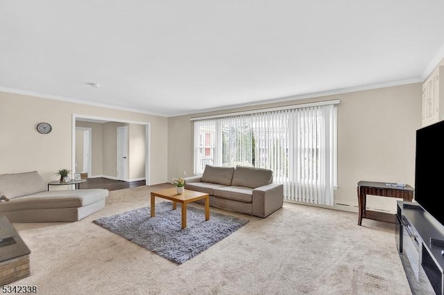 living area with carpet floors and crown molding