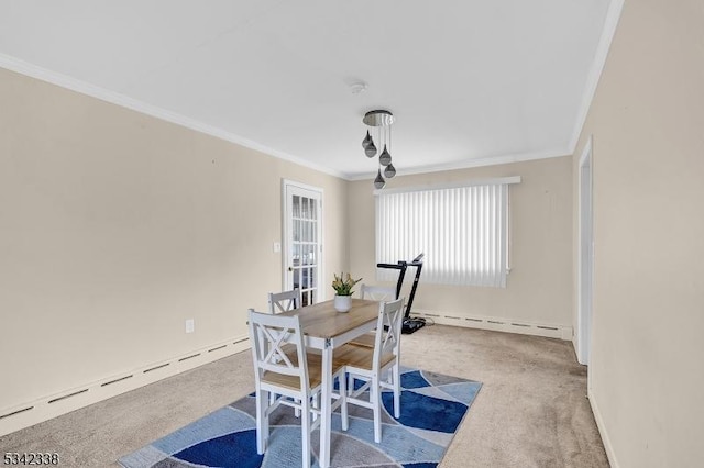 carpeted dining space featuring ornamental molding, baseboards, and baseboard heating