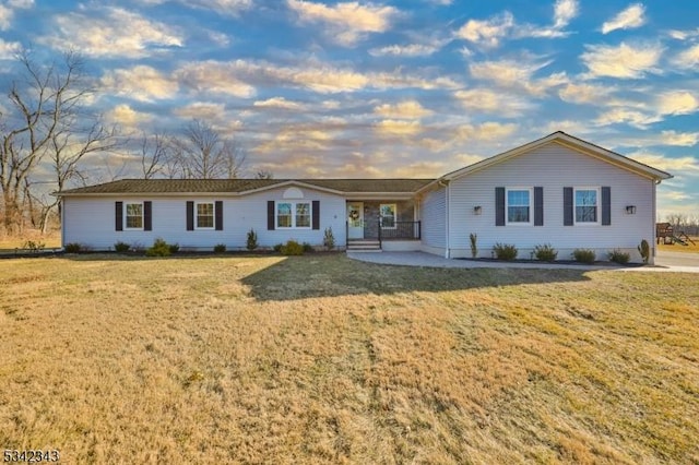 ranch-style home with a front yard