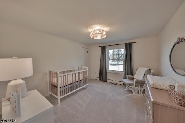 bedroom with a nursery area and light carpet