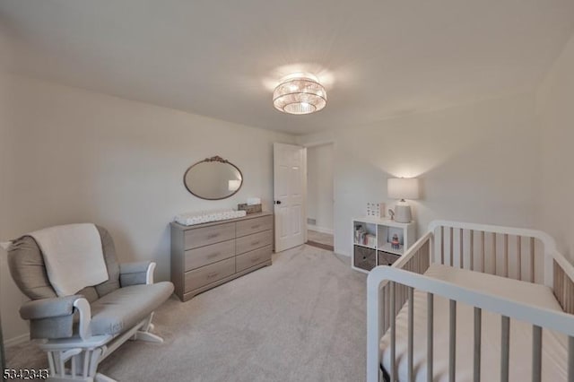 bedroom featuring light carpet