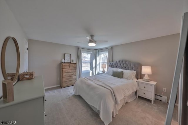 bedroom featuring a baseboard radiator, baseboards, a ceiling fan, and light colored carpet