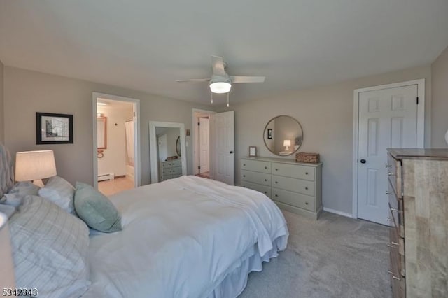 bedroom with connected bathroom, light carpet, ceiling fan, and baseboards