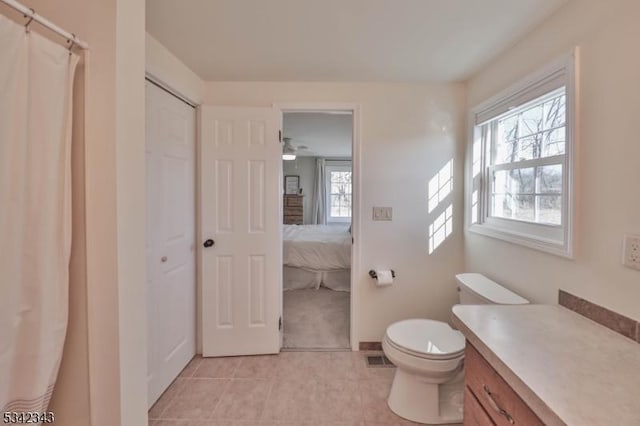 full bath featuring visible vents, vanity, toilet, and tile patterned floors