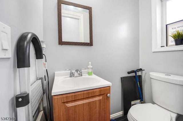 bathroom with toilet and vanity