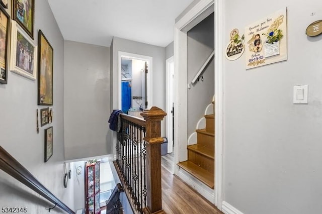 stairs with wood finished floors