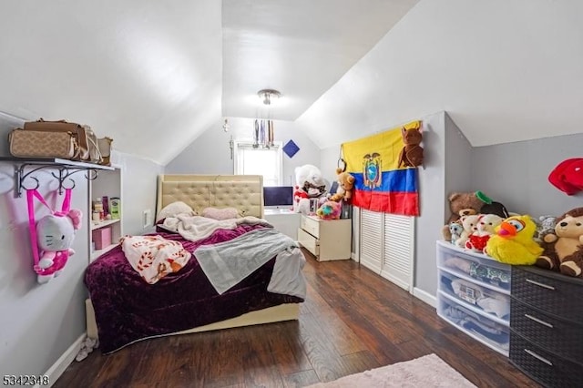 bedroom with hardwood / wood-style flooring, baseboards, and vaulted ceiling