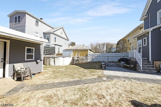 view of yard with a fenced in pool and fence