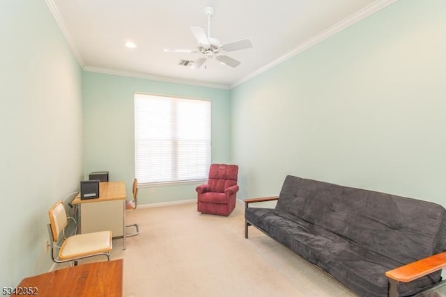 sitting room with visible vents, ornamental molding, carpet floors, baseboards, and ceiling fan