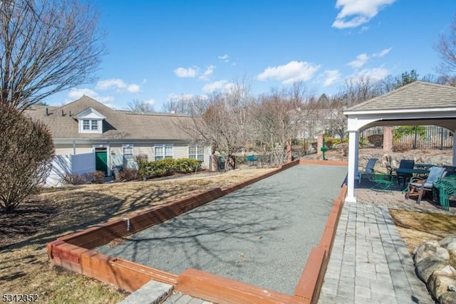 view of pool with a gazebo and fence