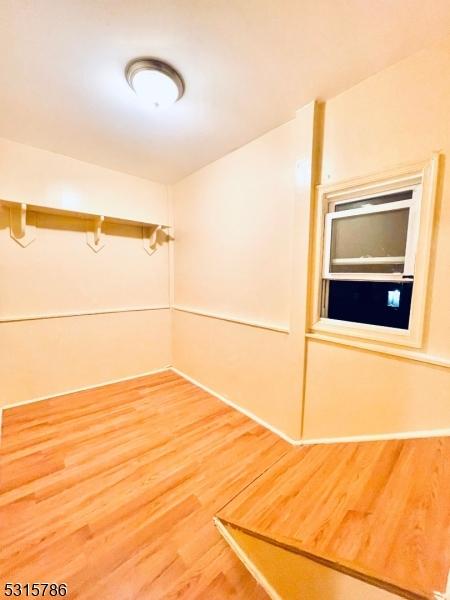 empty room with light wood-type flooring