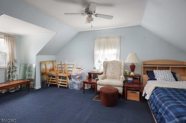 carpeted bedroom with vaulted ceiling and ceiling fan