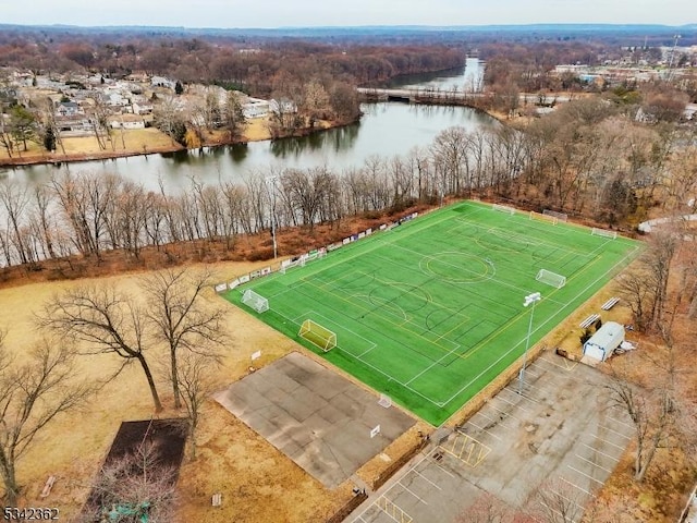 birds eye view of property with a water view