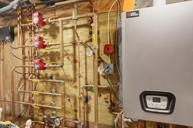 utility room with water heater