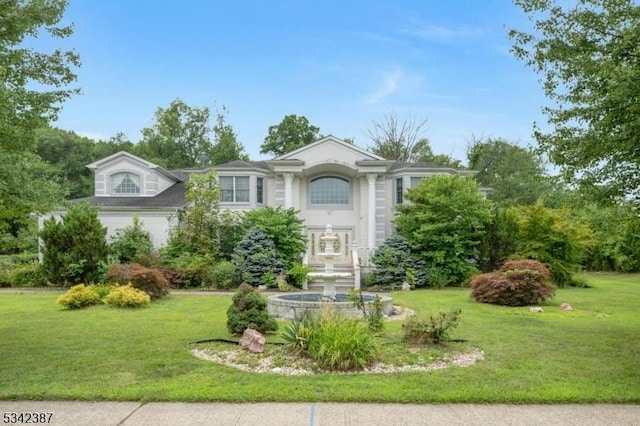 view of front of home with a front lawn