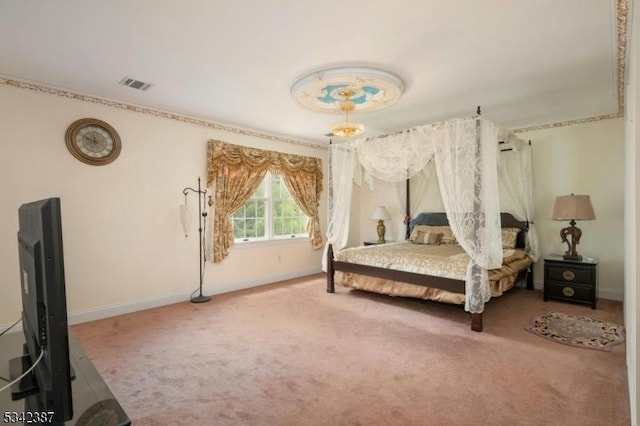 carpeted bedroom featuring visible vents and baseboards