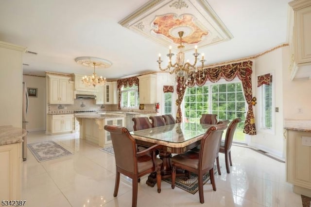 dining area featuring baseboards, ornamental molding, light tile patterned floors, and an inviting chandelier