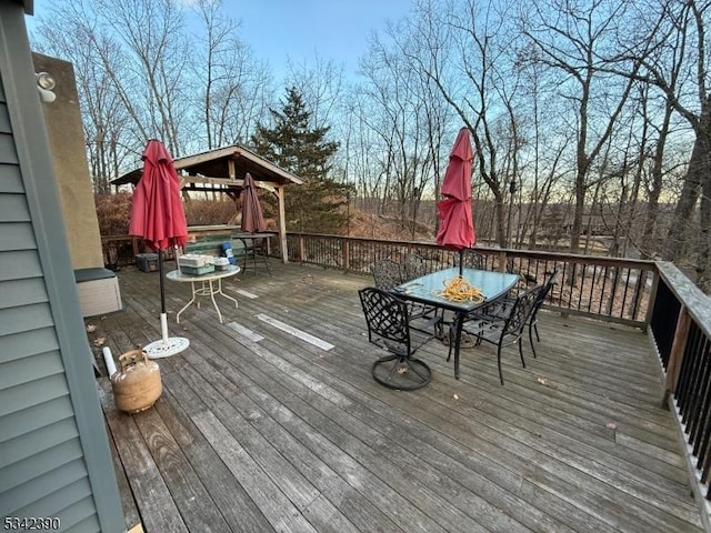 wooden deck with outdoor dining area