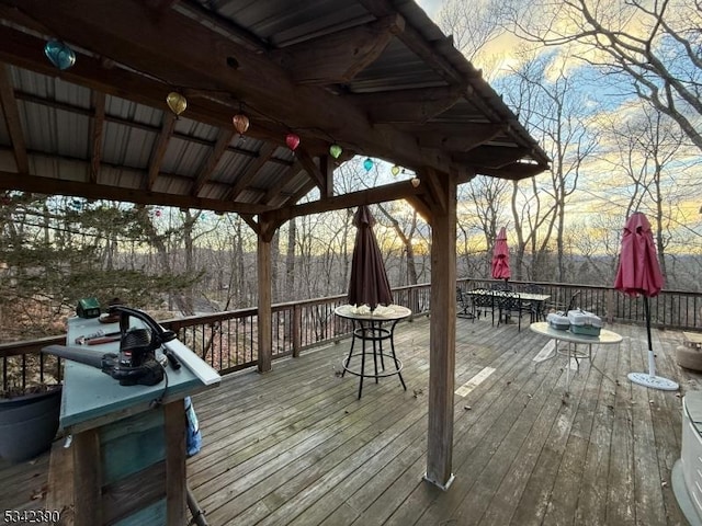 wooden terrace with outdoor dining space